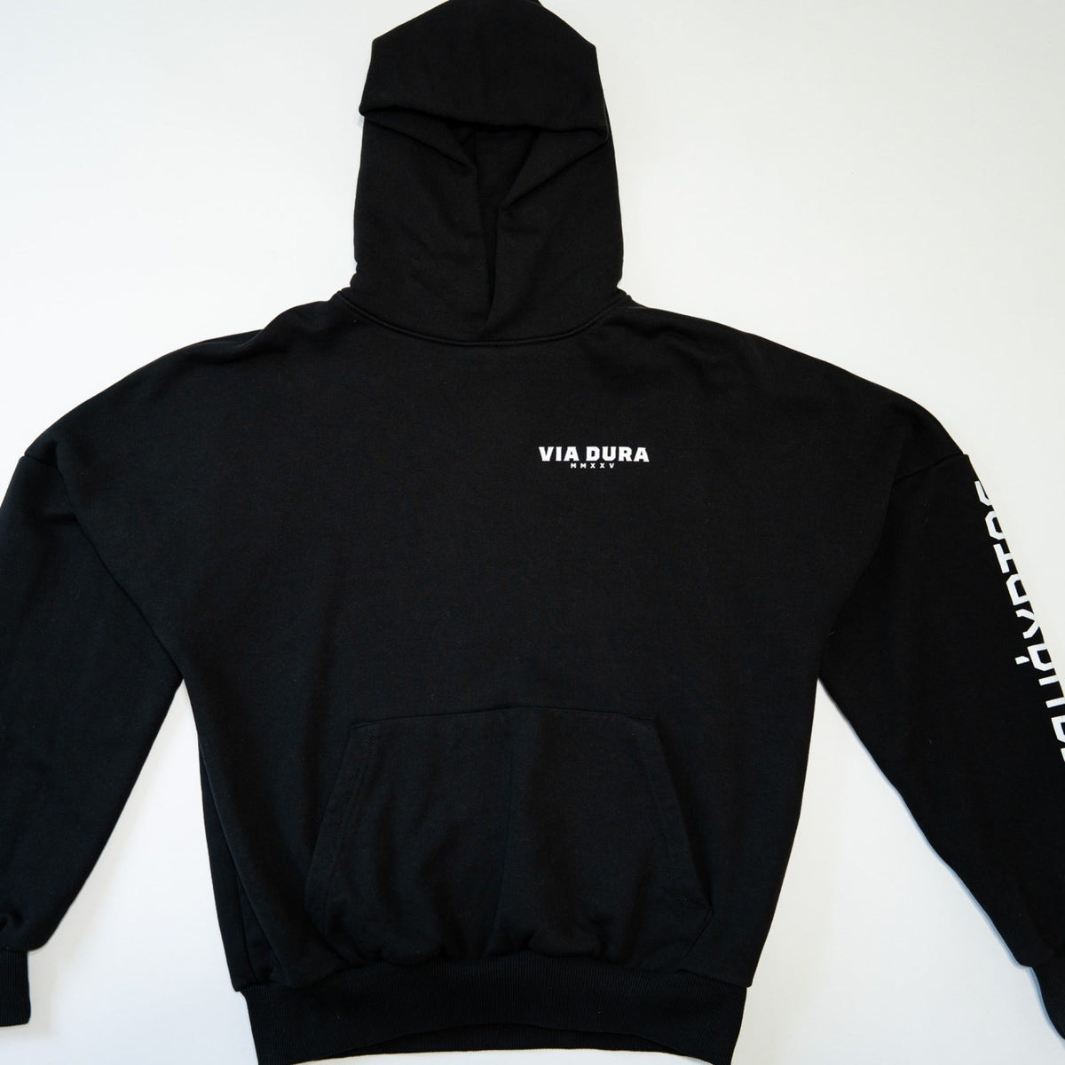 Spartan Hoodie in Black — front, Via Dura MMXXV chest print